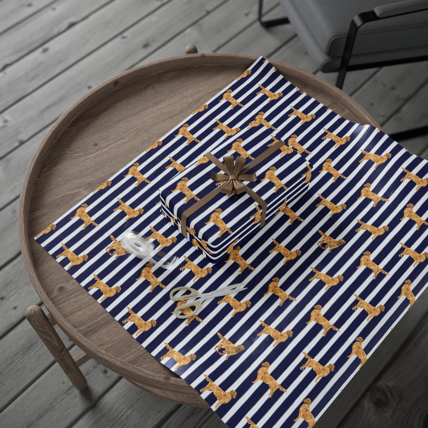 Navy and Blue and White striped wrapping paper featuring a dog illustration place on a table with wrapped gift