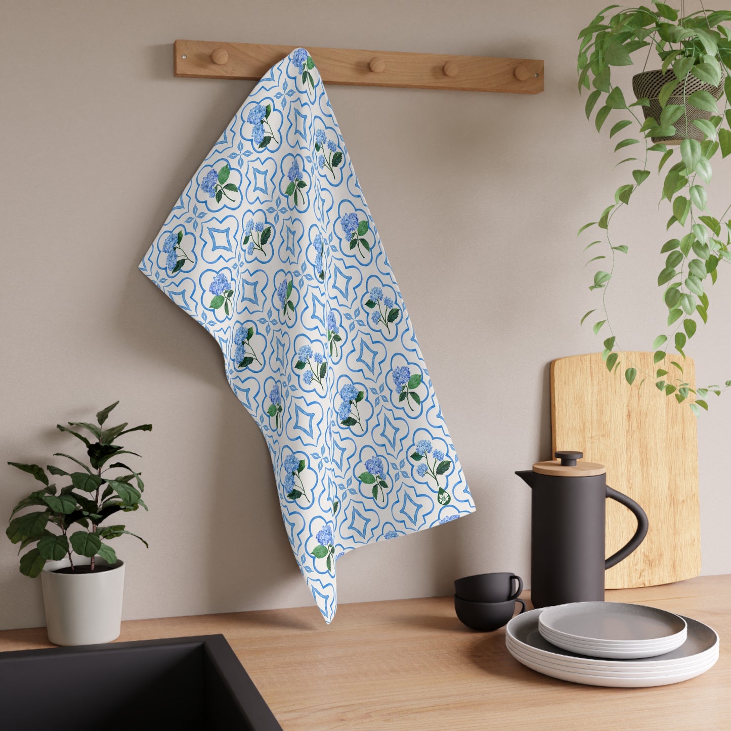 Garden Trellis Kitchen Towel hanging on dish towel knob in kitchen over counter in Cloudless Blue Colorway