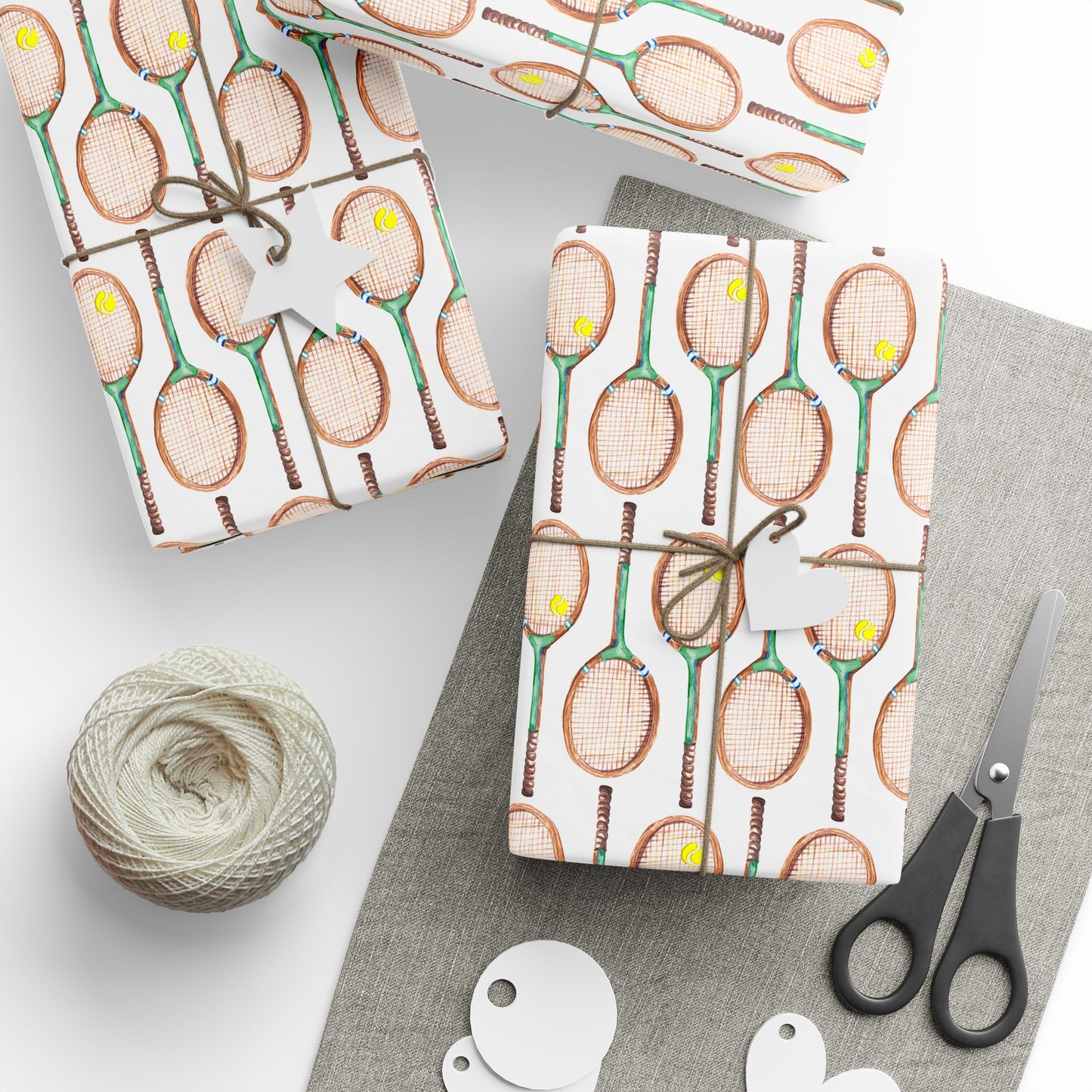 Topspin Tennis Wrapping Paper on table with wrapping tape, string, and scissors and wrapped gifts in Tennis Grass Green Color Choice