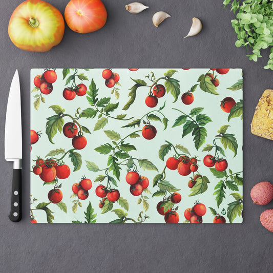Large Tomato Tomato tempered glass cutting board on counter with fruit and chefs knife