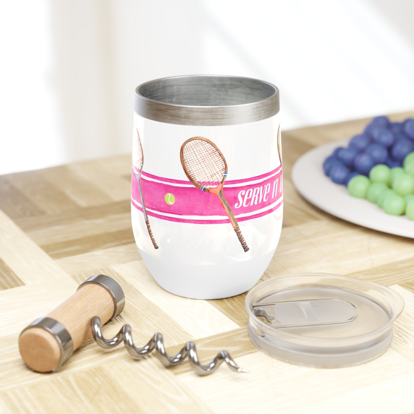 Stainless Steel wine tumbler Illustrated with pink stripe and tennis racquets with the phrase "Serve It Up"