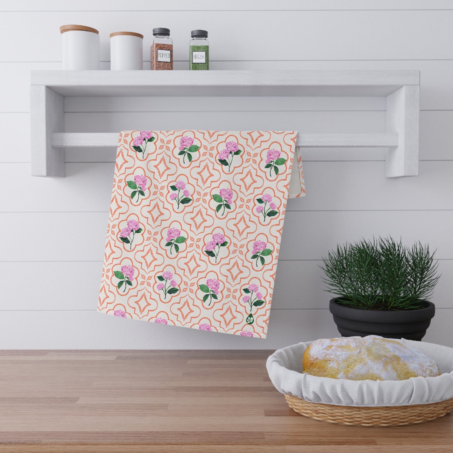 Garden Trellis Kitchen Towel hanging on dish towel rack in kitchen over counter in Sherbert Orange Colorway