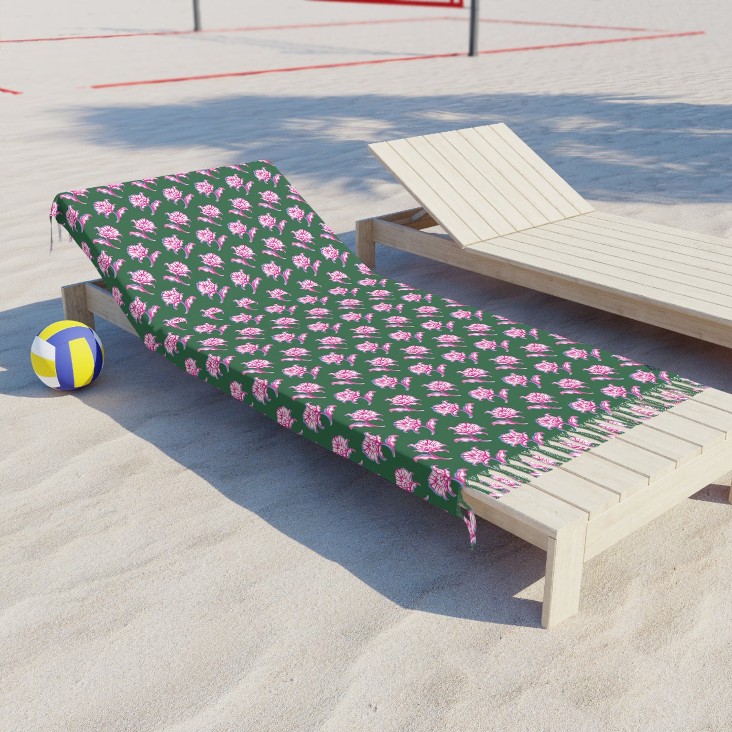 Side View of Watercolor Woodblock Beach Towel with Tassels on a beach lying across beach lounger by volleyball net in Tennis Grass Color Option