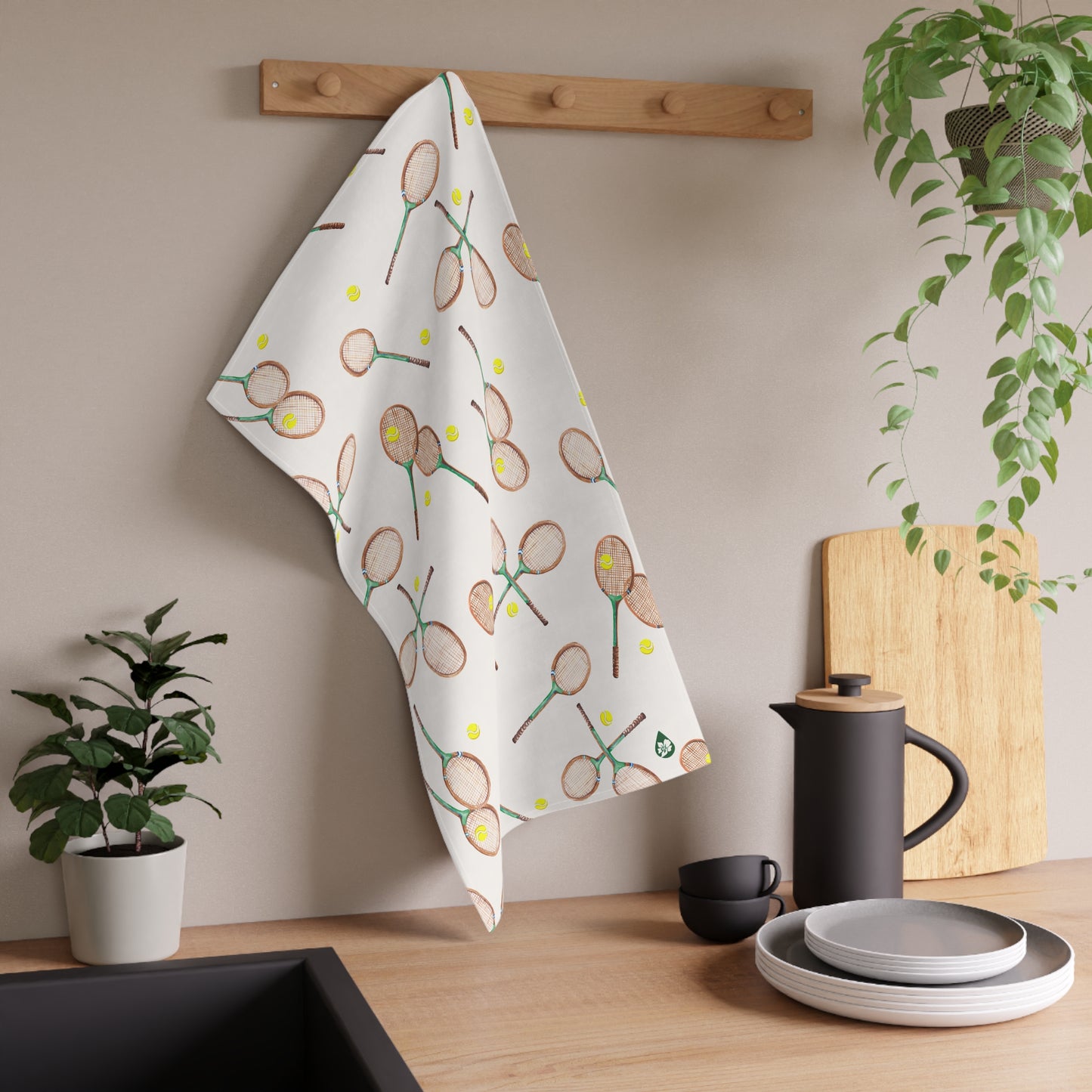 Match Point Patterned Kitchen Towel Hanging on drying rack over sink in Tennis Grass Green Colorway
