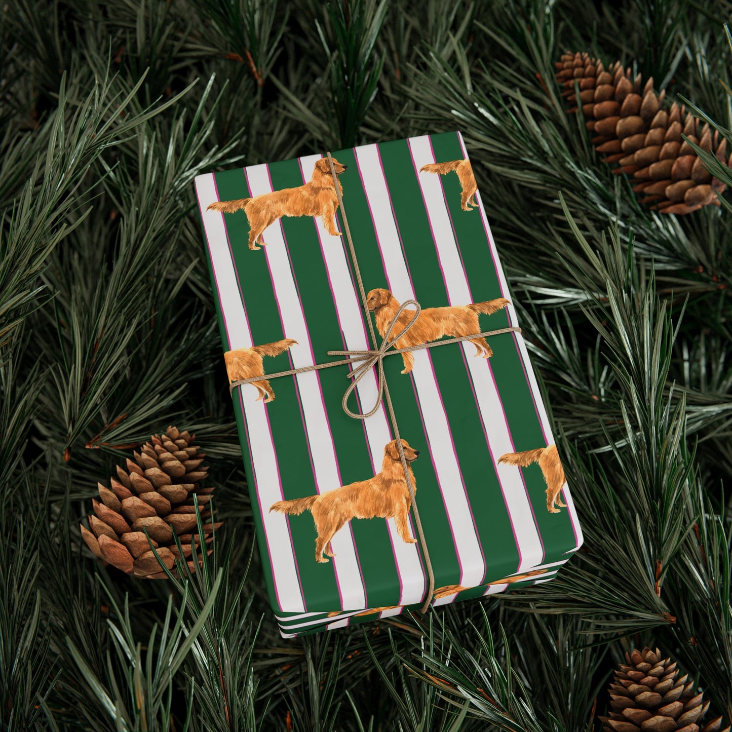Green and Pink and White striped wrapping paper featuring a dog illustration wrapped gift with brown bow laying on a Pine Tree
