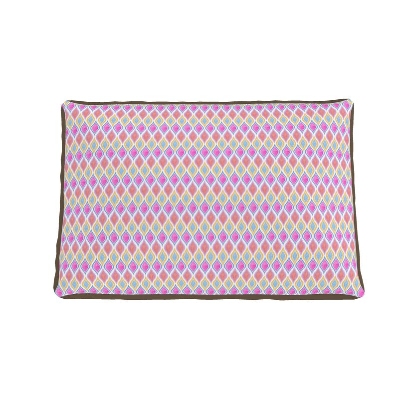 Top view of painted geo printed dog bed in warm color tones