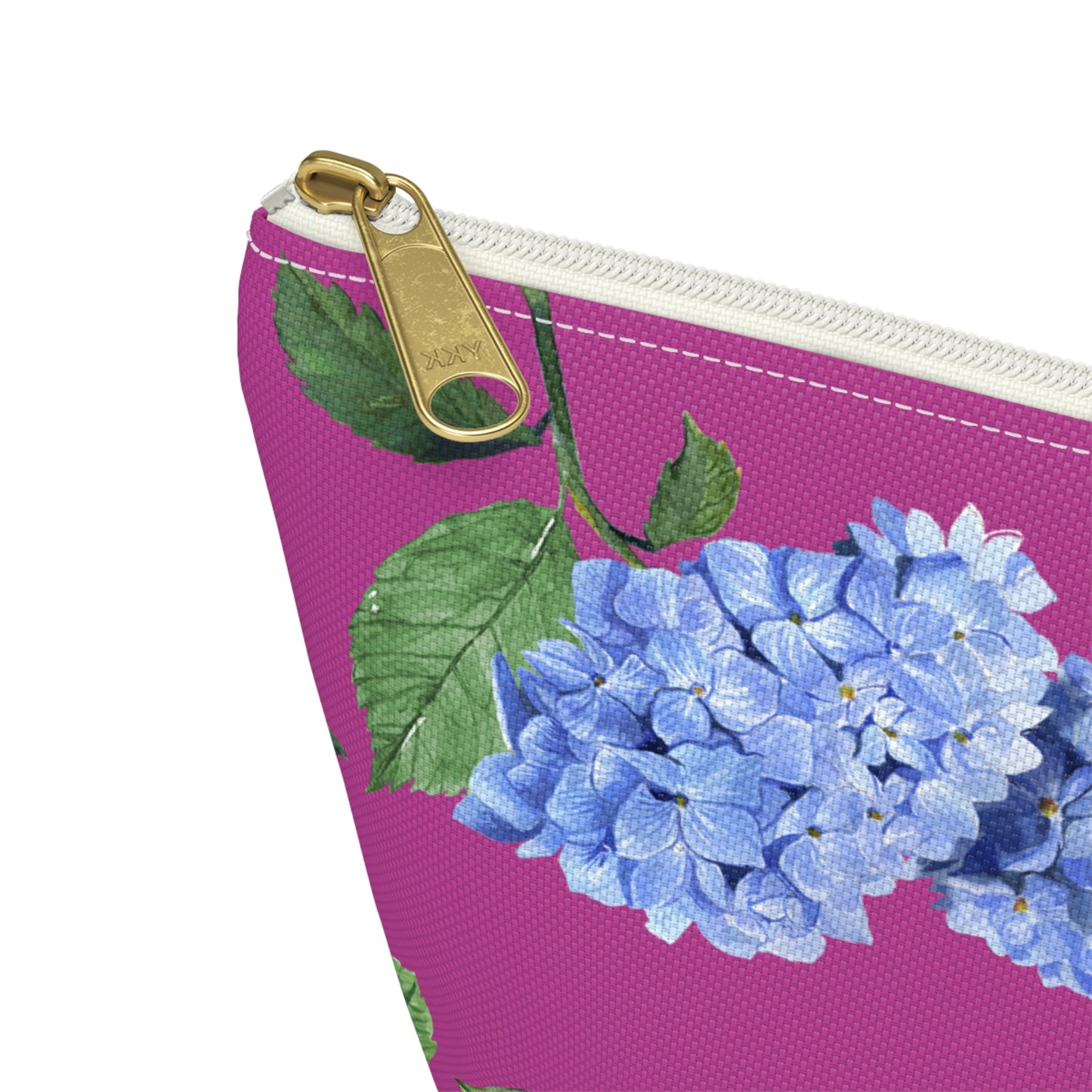 Zoomed view of T bottom pouch in Hydrangea pattern Peony Pink with white zipper