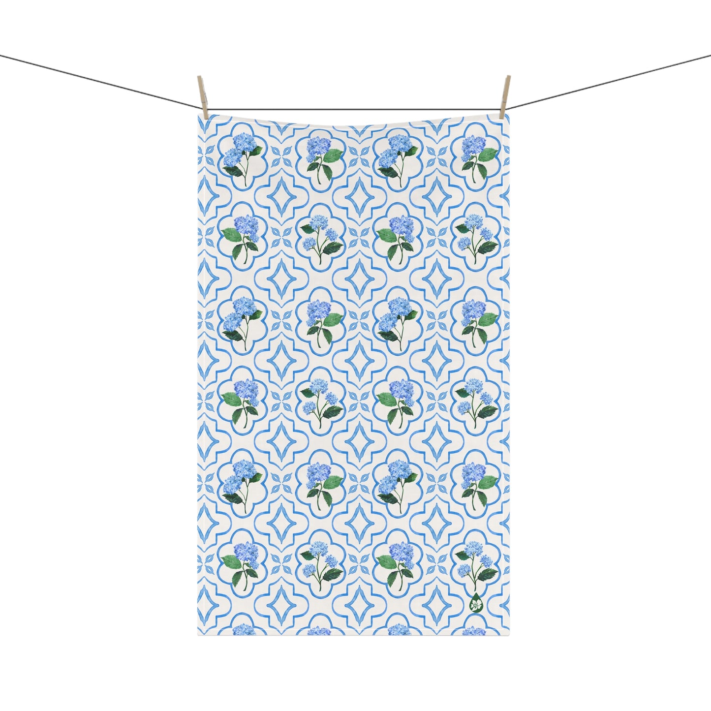 Garden Trellis Kitchen Towel hanging on clothes line in Cloudless Blue Colorway