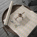 Topspin Tennis Wrapping Paper Roll on table with wrapped gift and extra sheet of paper in Tennis Grass Green color Choice