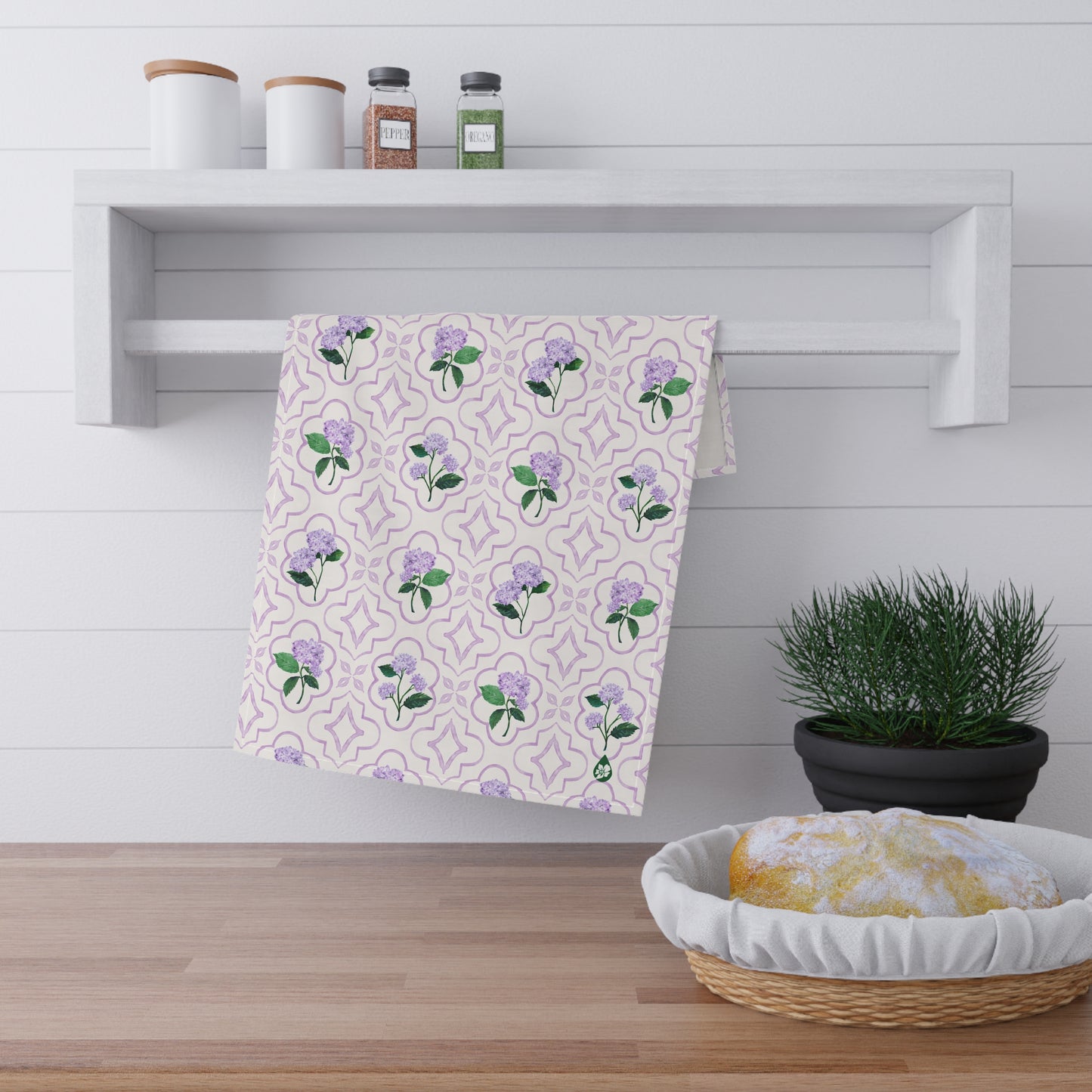Garden Trellis Kitchen Towel hanging on kitchen towel rack in Hydrangea Purple Colorway