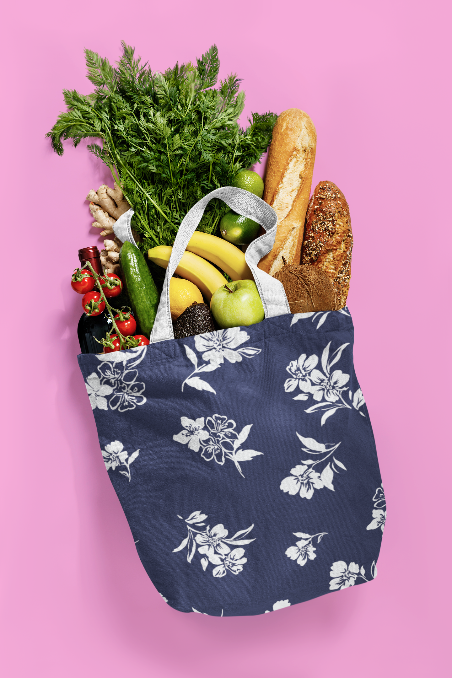 Twilight Inky Floral tote bag filled with groceries spilling onto pink ground