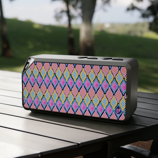 Painted Geo Bluetooth Speaker on Picnic table with field in distance