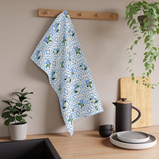 Garden Trellis Kitchen Towel hanging on dish towel knob in kitchen over counter in Cloudless Blue Colorway