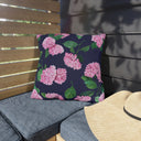 Hydrangea Patterned Outdoor Pillow in Twilight on Porch Bench next to beach hat