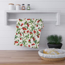 View of Tomato Tomato Kitchen towel hanging on spice rack railing over counter with sourdough bread and plant