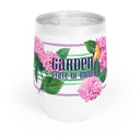 Garden State illustrated wine tumbler with hydrangeas and bird and green and purple stripe next to plastic lid with closure