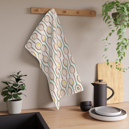 Topspin Tennis print kitchen towel in green hanging on hook over kitchen counter