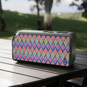 Painted Geo Bluetooth Speaker on Picnic table with field in distance