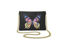 Black clutch bag with gold strap and colorful butterfly