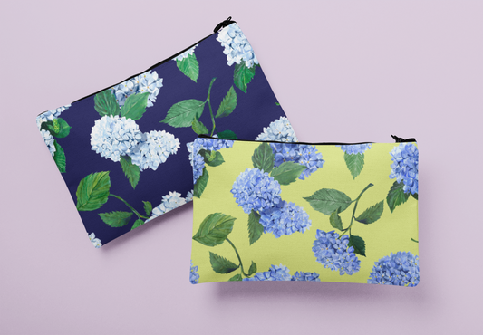 Two Hydrangea zip pouches in Twilight Navy and Honeydew colorways