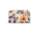 A zip-around wallet with a cream background and a vibrant print of butterflies and yellow-orange orchids, shown on a plain white background.
